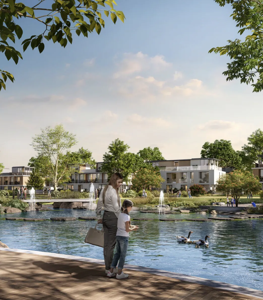 A mother and child by the lake at The Valley, developer visual