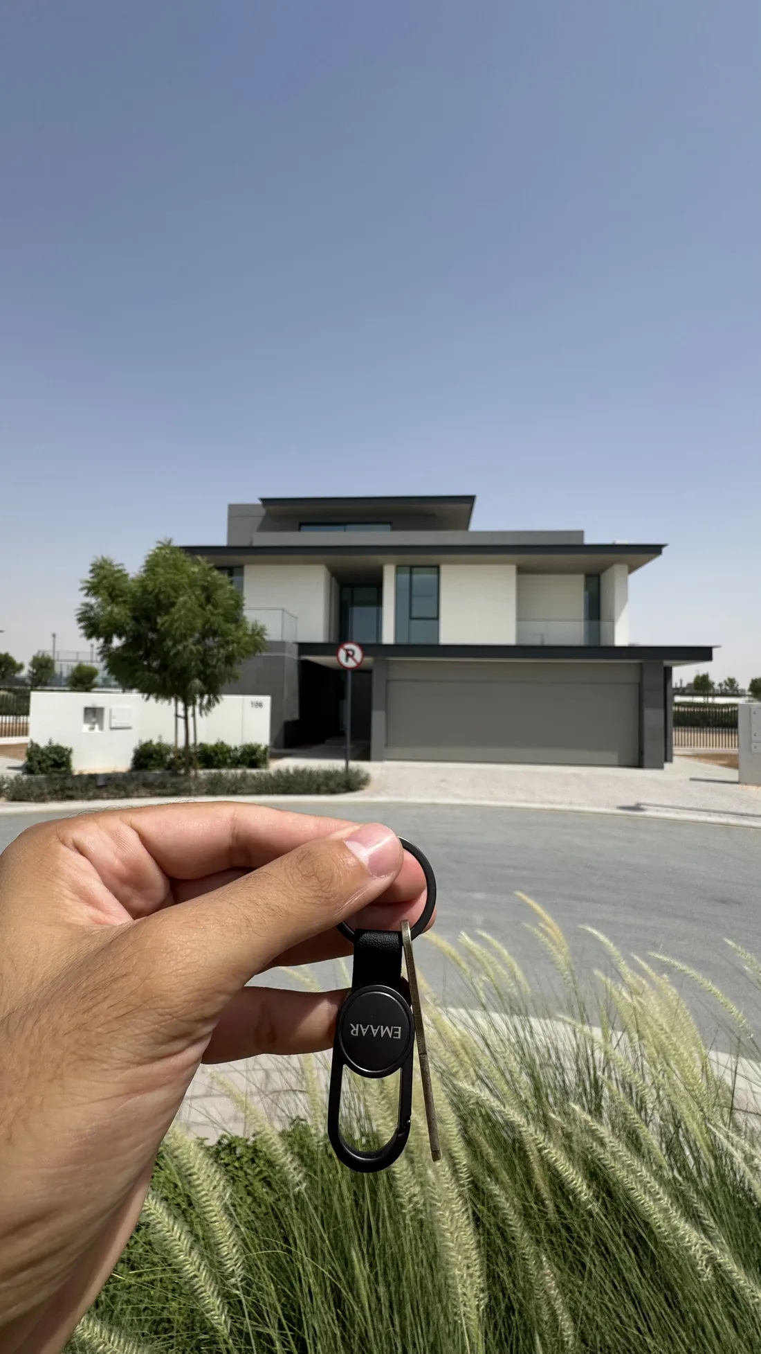 Holding the keys in front of a new villa